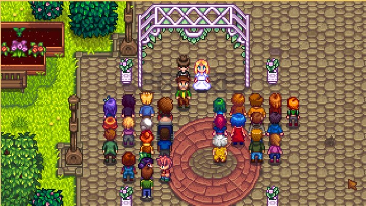 A wedding ceremony in Stardew Valley. The player is tying the knot with Haley, who is dressed in a beautiful wedding gown. They are positioned beneath a decorative arch, surrounded by the townspeople who are observing the moment.